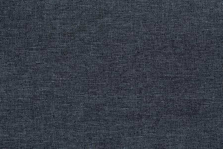 Canvas Polyester texture synthetical for background. Black fabric textile backdrop for interior art design or add text message.の写真素材