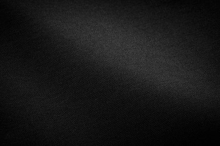 Black Canvas Polyester texture synthetical for background. Black fabric textile backdrop for interior art design or add text message.の写真素材