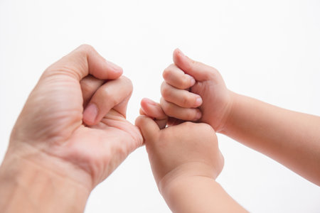 Abstract baby holding father's hand. Love and care.  We will go together.の写真素材