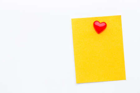 Abstract empty sticky note with heart magnet on white board. valentine greeting card message.の写真素材