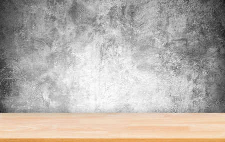 Abstract Natural wood table with backdrop concrete grunge paint wall background. Top view of plank wood for graphic stand product, interior design or montage display your productの写真素材