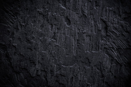 Abstract grungy black concrete seamless background. Stone texture for painting on ceramic tile wallpaper. Cement grunge backdrop for design art work and pattern.の写真素材