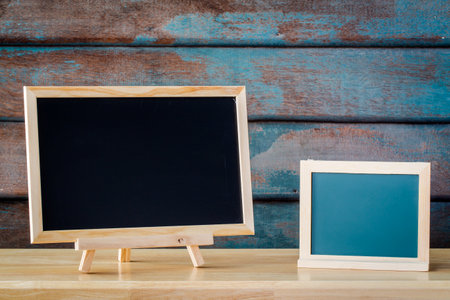 Wooden plank table for graphic stand product, interior design or montage display your product with blank texture blackboard with chalk for background. education concept.の写真素材