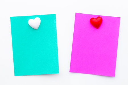 Abstract empty sticky note with heart magnet on white board. valentine greeting card message.の写真素材