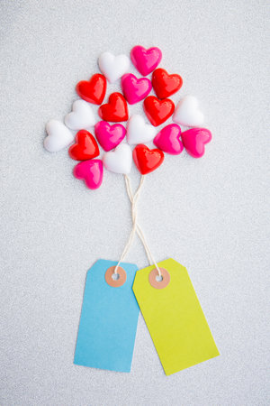 Abstract valentine 's day, Red Heart with paper tag on white texture for graphic design or add text message. Love concept.の写真素材