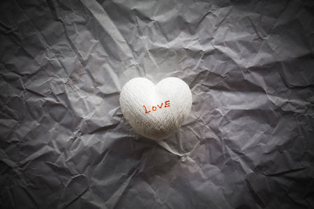 crumpled paper with heart, valentine paper backgroundの写真素材