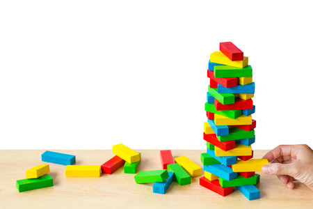 Management planning risk and strategy project in business engineer with hand put color wooden block on tower. Business construction or education concept. picture copy space for add text message.の写真素材