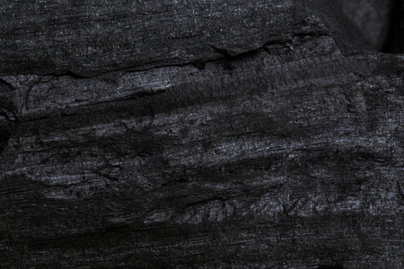 Natural black charcoal from old tree. High wood energy coal for warm in the winter or for household.