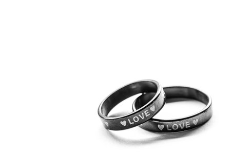 Black and White Love Wedding Rings on white background.の写真素材