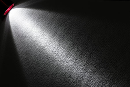 LED black flashlight for background. abstract spotlight on white texture. picture backdrop for add showcase premium product or add text message.の写真素材