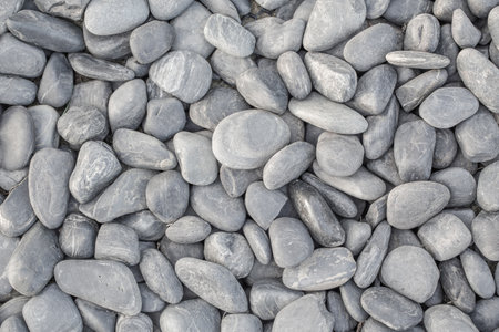 small smooth waterworn black pebbles or stones for use decor and garden landscaping. tone garden interiors. stone spaの写真素材