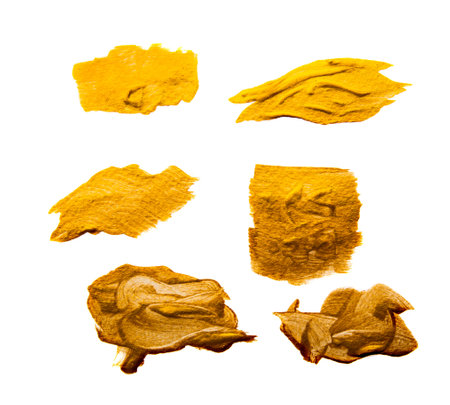 Abstract gilded acrylic paint gold brush strokes on white background copy space for text or art work design.の写真素材
