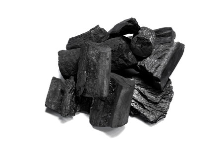 Natural black charcoal from old tree. High wood energy coal for warm in the winter or for household.の写真素材