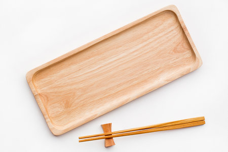 Empty sushi tray board on white background. Top view of plank wood for graphic stand product, interior design or montage display your product.の写真素材
