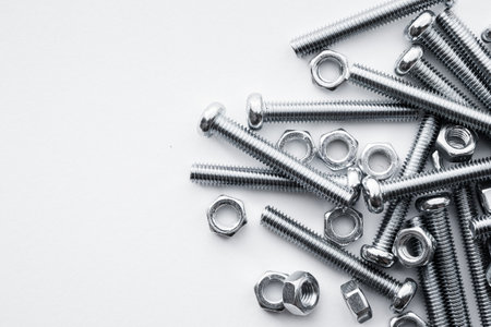 Nuts and bolts closeup on white backgroundの写真素材