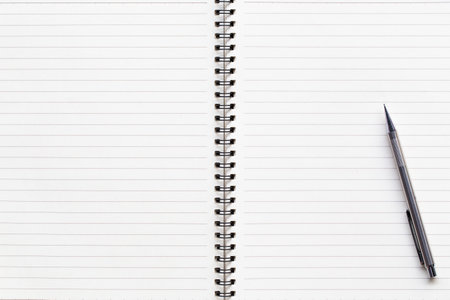 White note paper notebook with pencil on wooden table. picture used for add text or education message.の写真素材