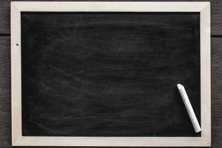 Chalk rubbed out on blackboard for background. picture for add text or education background.の写真素材