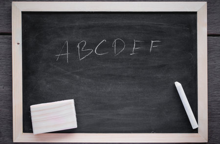 Chalk rubbed out on blackboard for background. picture for text or education background.の写真素材