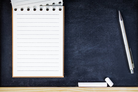 book note on black board. paper note for add text.の写真素材