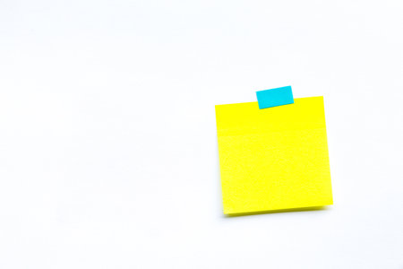 Abstract empty sticky note, isolated on white backgroundの写真素材