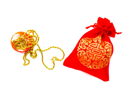Money in Red bag on white background. Greeting cards for good luck and happiness in the Chinese New Year.の写真素材