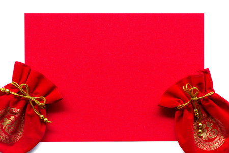 Money in Red bag and gold necklace on red texture background. Greeting cards for good luck and happiness in the Chinese New Year.の写真素材