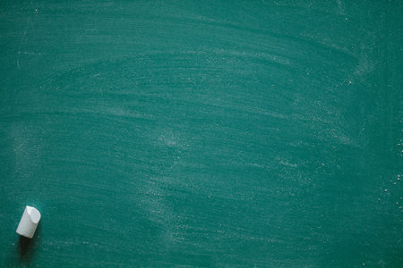 Green Chalkboard. Chalk texture school board display for background. chalk traces erased with copy space for add text or graphic design. Education conceptsの写真素材