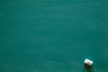 Green Chalkboard. Chalk texture school board display for background. chalk traces erased with copy space for add text or graphic design. Education conceptsの写真素材