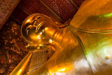 Golden sleeping buddha statueの写真素材