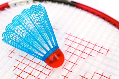 Blue badminton shuttlecock on the racketの写真素材