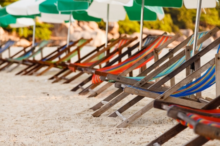 Close up of colorful beach chairs on the beach, with shallow depth of fieldの写真素材
