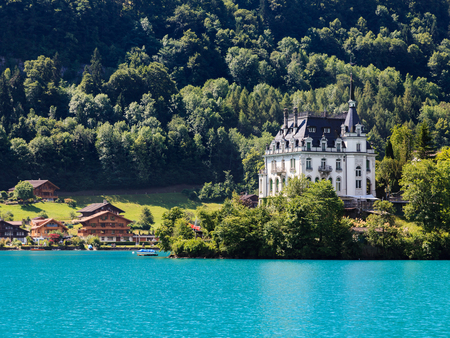 Iseltwald castle, view from alpine lake Brienz of Jungfrau region, Switzerlandのeditorial素材
