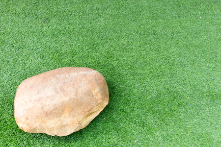 stone on grass green backgroundの写真素材