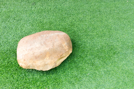 stone on grass green backgroundの写真素材