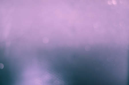 abstract circle purple bokeh on black backgroundの写真素材