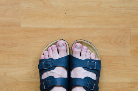 Feet on the wooden floor