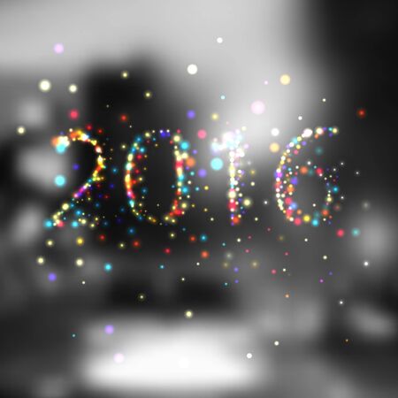 Happy new year 2016 writing sparkles firework with dirty defocused light blur bokeh background