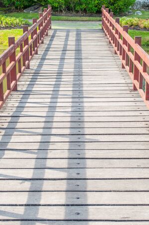 Wooden bridge with red handrailの写真素材