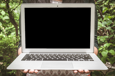 Blank background laptop on woman's handの写真素材