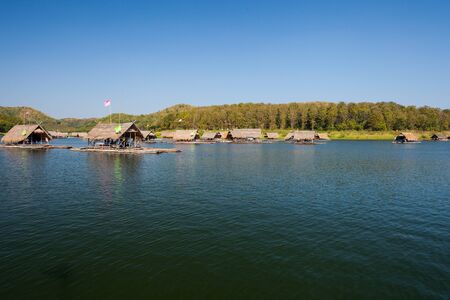 Bamboo raft floating on water in dam located at north east of Thailandの写真素材