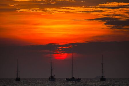 Yachts are floating on sea under vivid colorful sky at sunset timing on sea located at  south of ...