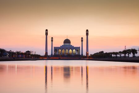 A silhouette of a mosque at sunset under colorful vivid color sky located at south of Thailandの写真素材