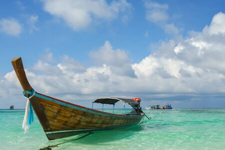 Long boat under clear sky on sea