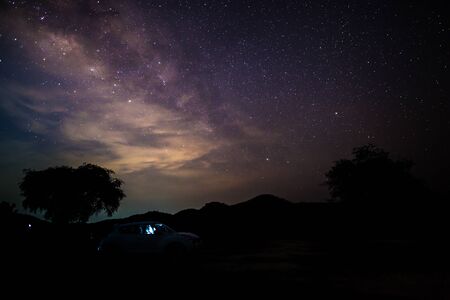 Milky way at nigh sky above mountain location at Kanchanaburi , Thailandの写真素材
