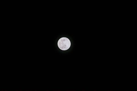 A moon at day time on clear blue skyの写真素材