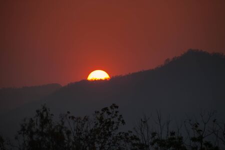 Colorful sky of sunrise above mountain on cloudy at winter season location at Loei province north east of Thailandの写真素材