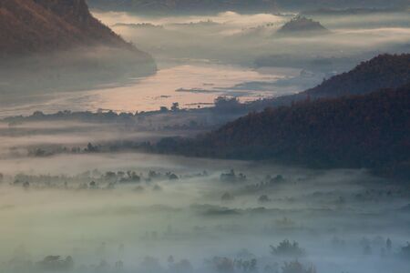 Colorful sky of sunrise above mountain on cloudy at winter season location at Loei province north...