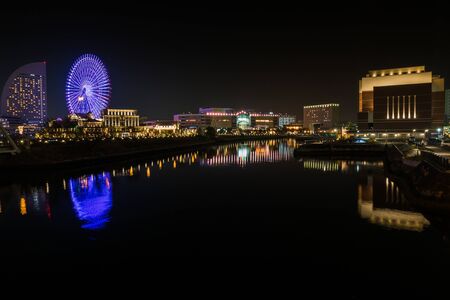 Water reflection of wonderful color at night time ,cityscape view at Yokohama japanの写真素材