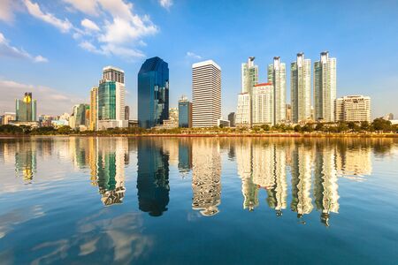 A night cityscape view of modern building reflection on water located at center of Bangkok thailandの写真素材