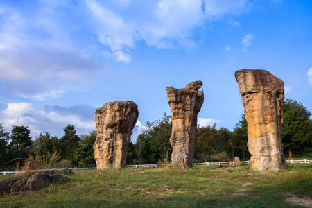 A Stonehenge of Thailand under clear 
blue sky in front of green grass located at north east of Thailandのeditorial素材
